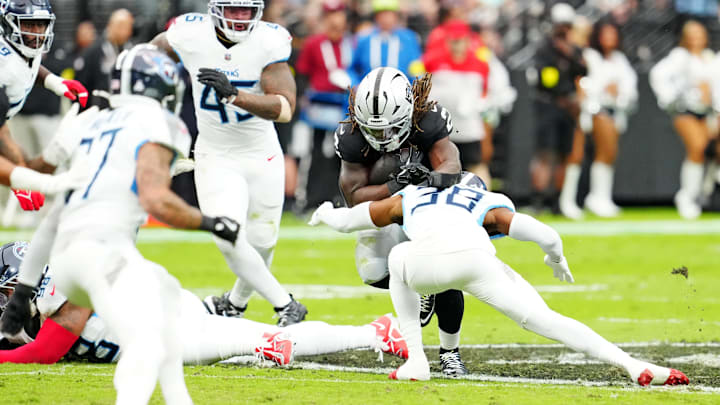 Oct 12, 2025; Paradise, Nevada, USA; Las Vegas Raiders running back Ashton Jeanty (2) runs the ball against Tennessee Titans cornerback L'Jarius Sneed (38) during the first half at Allegiant Stadium. Mandatory Credit: Stephen R. Sylvanie-Imagn Images Oct 12, 2025; Paradise, Nevada, USA; Las Vegas Raiders running back Ashton Jeanty (2) runs the ball against Tennessee Titans cornerback L'Jarius Sneed (38) during the first half at Allegiant Stadium. Mandatory Credit: Stephen R. Sylvanie-Imagn Images