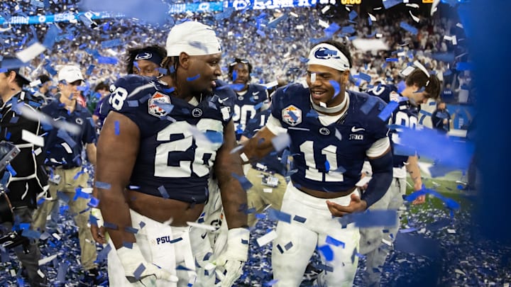 Penn State Nittany Lions defensive end Abdul Carter (11) celebrates with defensive tackle Zane Durant (28) after defeating the Boise State Broncos during the Fiesta Bowl at State Farm Stadium. 
