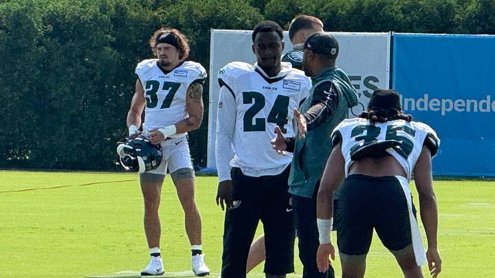 Rookie Drew Mukuba gets instruction from DB coach Christian Parker during Day 8 of Eagles training camp. Rookie Drew Mukuba gets instruction from DB coach Christian Parker during Day 8 of Eagles training camp.