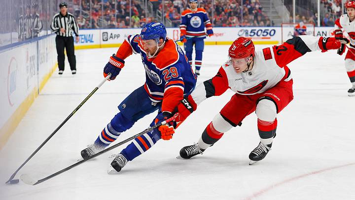 Mar 6, 2026; Edmonton, Alberta, CAN; Edmonton Oilers forward Leon Draisaitl (29) protects the puck from Carolina Hurricanes defensemen Alexander Nikishin (21) during the third period at Rogers Place. Mandatory Credit: Perry Nelson-Imagn Images Mar 6, 2026; Edmonton, Alberta, CAN; Edmonton Oilers forward Leon Draisaitl (29) protects the puck from Carolina Hurricanes defensemen Alexander Nikishin (21) during the third period at Rogers Place. Mandatory Credit: Perry Nelson-Imagn Images