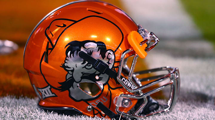 Jan 2, 2015; Tempe, AZ, USA; Detailed view of the chrome orange Oklahoma State Cowboys helmet against the Washington Huskies in the 2015 Cactus Bowl at Sun Devil Stadium. Mandatory Credit: Mark J. Rebilas-Imagn Images