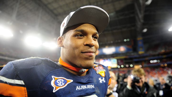 Jan 10, 2011; Glendale, AZ, USA; Auburn Tigers quarterback (2) Cam Newton against the Oregon Ducks in the 2011 BCS National Championship game at University of Phoenix Stadium. Auburn defeated Oregon 22-19. Mandatory Credit: Mark J. Rebilas-Imagn Images