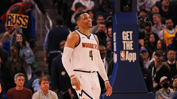 Mar 17, 2025; San Francisco, California, USA; Denver Nuggets guard Russell Westbrook (4) smiles ahead of a sign reading “Russ” after a play against the Golden State Warriors during the fourth quarter at Chase Center. Mandatory Credit: Kelley L Cox-Imagn Images Mar 17, 2025; San Francisco, California, USA; Denver Nuggets guard Russell Westbrook (4) smiles ahead of a sign reading “Russ” after a play against the Golden State Warriors during the fourth quarter at Chase Center. Mandatory Credit: Kelley L Cox-Imagn Images