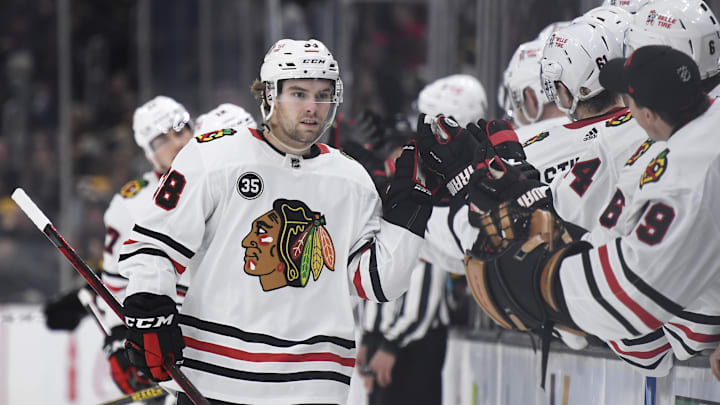 Mar 10, 2022; Boston, Massachusetts, USA; Chicago Blackhawks left wing Brandon Hagel (38) is congratulated by his teammates after scoring a goal during the third period against the Boston Bruins at TD Garden. Mandatory Credit: Bob DeChiara-Imagn Images