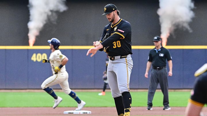 Aug 12, 2025; Milwaukee, Wisconsin, USA;  Pittsburgh Pirates starting pitcher Paul Skenes (30) reacts after giving up a solo home run to Milwaukee Brewers right fielder Sal Frelick (10) in the first inning at American Family Field. Mandatory Credit: Benny Sieu-Imagn Images