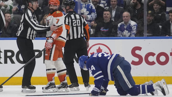 Mar 12, 2026; Toronto, Ontario, CAN; Anaheim Ducks defenseman Radko Gudas (7) looks at an injured Toronto Maple Leafs forward Auston Matthews (34) after he delivered a knee-on-knee hit during the second period at Scotiabank Arena. Mandatory Credit: John E. Sokolowski-Imagn Images Mar 12, 2026; Toronto, Ontario, CAN; Anaheim Ducks defenseman Radko Gudas (7) looks at an injured Toronto Maple Leafs forward Auston Matthews (34) after he delivered a knee-on-knee hit during the second period at Scotiabank Arena. Mandatory Credit: John E. Sokolowski-Imagn Images