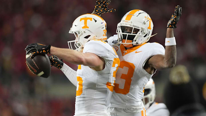 Tennessee defensive backs Will Brooks (35) and Boo Carter (23) celebrate after Brooks made an interception during the NCAA college football playoff game against Ohio State on Saturday, Dec. 21, 2024, in Columbus, Ohio.