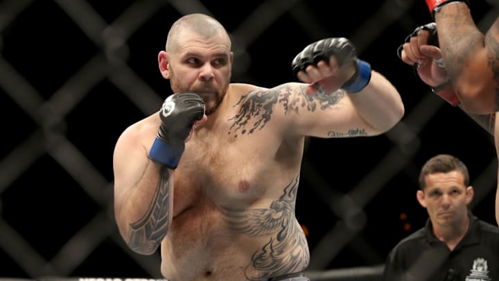 Feb 12, 2023; Perth, WA, AUSTRALIA; Justin Tafa (red gloves) fights Parker Porter (blue gloves) during UFC 284 at RAC Arena. Mandatory Credit: Jasmin Frank-Imagn Images Feb 12, 2023; Perth, WA, AUSTRALIA; Justin Tafa (red gloves) fights Parker Porter (blue gloves) during UFC 284 at RAC Arena. Mandatory Credit: Jasmin Frank-Imagn Images