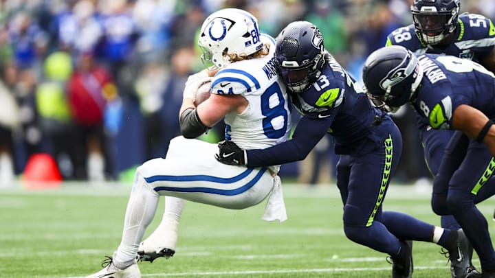 Dec 14, 2025; Seattle, Washington, USA; Seattle Seahawks linebacker Ernest Jones IV (13) tackles Indianapolis Colts tight end Tyler Warren (84) following a reception by Warren during the second quarter at Lumen Field. Mandatory Credit: Kevin Ng-Imagn Images Dec 14, 2025; Seattle, Washington, USA; Seattle Seahawks linebacker Ernest Jones IV (13) tackles Indianapolis Colts tight end Tyler Warren (84) following a reception by Warren during the second quarter at Lumen Field. Mandatory Credit: Kevin Ng-Imagn Images