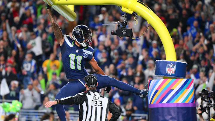 Oct 20, 2025; Seattle, Washington, USA; Seattle Seahawks wide receiver Jaxon Smith-Njigba (11) celebrates on the goal post after a touchdown during the first quarter against the Houston Texans at Lumen Field. Mandatory Credit: Steven Bisig-Imagn Images Oct 20, 2025; Seattle, Washington, USA; Seattle Seahawks wide receiver Jaxon Smith-Njigba (11) celebrates on the goal post after a touchdown during the first quarter against the Houston Texans at Lumen Field. Mandatory Credit: Steven Bisig-Imagn Images