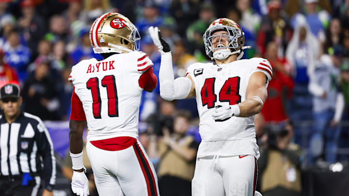 Oct 10, 2024; Seattle, Washington, USA; San Francisco 49ers fullback Kyle Juszczyk (44) celebrates with wide receiver Brandon Aiyuk (11) after rushing for a touchdown against the Seattle Seahawks at Lumen Field. Mandatory Credit: Joe Nicholson-Imagn Images