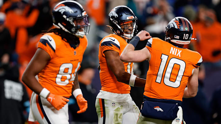 Dec 15, 2024; Denver, Colorado, USA; Denver Broncos wide receiver Courtland Sutton (14) celebrates with quarterback Bo Nix (10) after a touchdown ahead of wide receiver Lil'Jordan Humphrey (84) in the fourth quarter against the Indianapolis Colts at Empower Field at Mile High. Mandatory Credit: Isaiah J. Downing-Imagn Images