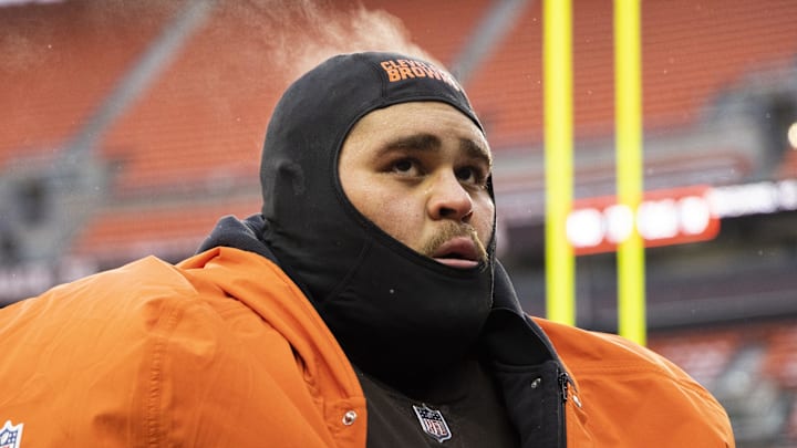 Dec 24, 2022; Cleveland, Ohio, USA; Steam comes off the head of Cleveland Browns offensive tackle Jedrick Wills Jr. (71) as he walks off the field following the game against the New Orleans Saints at FirstEnergy Stadium. Mandatory Credit: Scott Galvin-Imagn Images