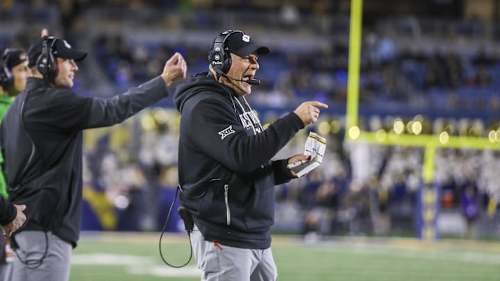 Oct 25, 2025; Morgantown, West Virginia, USA; West Virginia Mountaineers head coach Rich Rodriguez calls out a play during the third quarter against the Texas Christian University Horned Frogs at Milan Puskar Stadium. Mandatory Credit: Ben Queen-Imagn Images