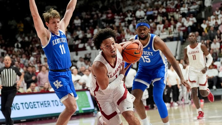 Feb 22, 2025; Tuscaloosa, AL, USA; Alabama guard Mark Sears (1) is fouled as he splits between Kentucky guard Travis Perry (11) and Kentucky forward Ansley Almonor (15) at Coleman Coliseum. Mandatory Credit: Gary Cosby Jr.-Tuscaloosa News
