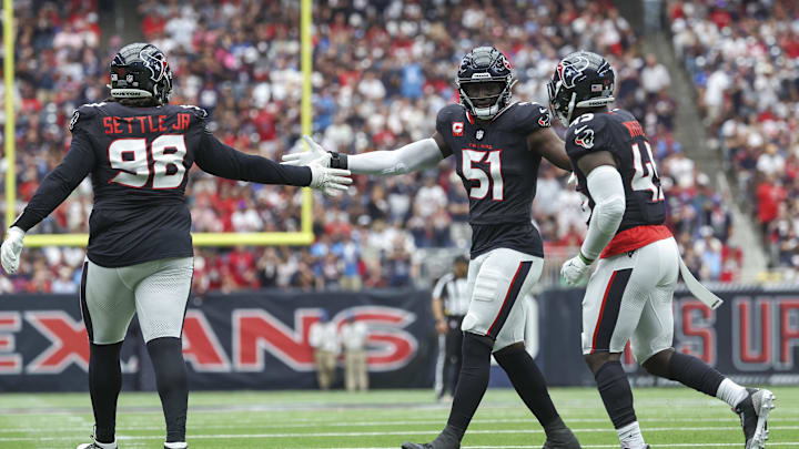 Oct 27, 2024; Houston, Texas, USA; Houston Texans defensive end Will Anderson Jr. (51) congratulates defensive tackle Tim Settle Jr. (98) and linebacker Devin White (45) after a play during the game against the Indianapolis Colts at NRG Stadium. Mandatory Credit: Troy Taormina-Imagn Images