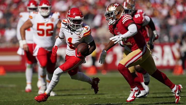 Oct 20, 2024; Santa Clara, California, USA; Kansas City Chiefs wide receiver Xavier Worthy (1) runs with the ball after making a catch in front of San Francisco 49ers cornerback Deommodore Lenoir (2) in the second quarter at Levi's Stadium. Mandatory Credit: Cary Edmondson-Imagn Images