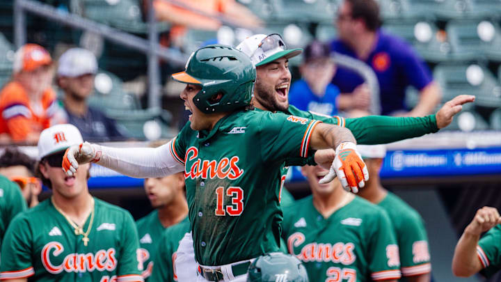 Miami (FL) Hurricanes infielder Antonio Jimenez (13) celebrates with infielder Dorian Gonzalez Jr. (0) after a three run homer against the Clemson Tigers in the second inning during the ACC Baseball Tournament at Truist Field. Miami (FL) Hurricanes infielder Antonio Jimenez (13) celebrates with infielder Dorian Gonzalez Jr. (0) after a three run homer against the Clemson Tigers in the second inning during the ACC Baseball Tournament at Truist Field.