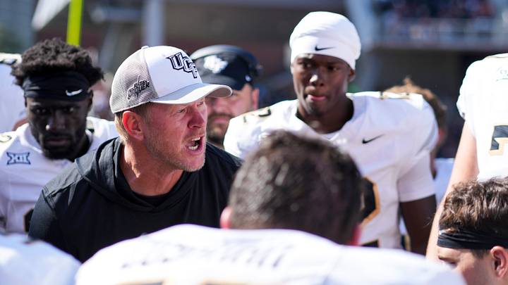 Oct 11, 2025; Cincinnati, Ohio, USA; UCF Knights head coach Scott Frost talks with his team on the sidelines in the game against the Cincinnati Bearcats in the second half at Nippert Stadium. Mandatory Credit: Aaron Doster-Imagn Images Oct 11, 2025; Cincinnati, Ohio, USA; UCF Knights head coach Scott Frost talks with his team on the sidelines in the game against the Cincinnati Bearcats in the second half at Nippert Stadium. Mandatory Credit: Aaron Doster-Imagn Images