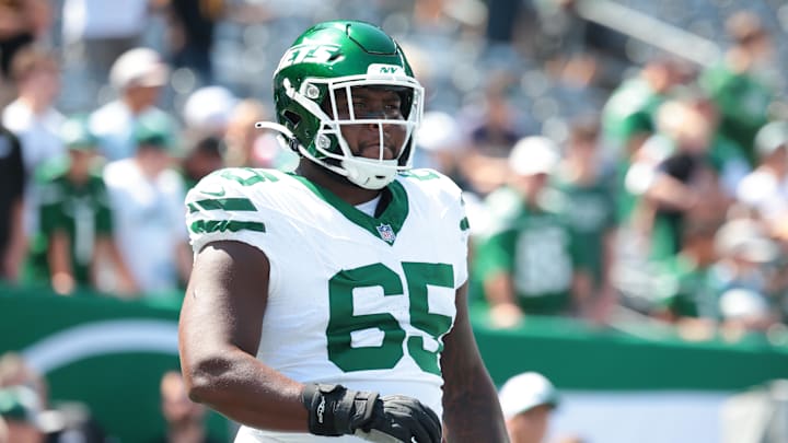 Aug 10, 2024; East Rutherford, New Jersey, USA; New York Jets guard Xavier Newman (65) looks on before the game against the Washington Commanders at MetLife Stadium.