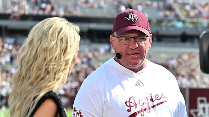 Oct 5, 2024; College Station, Texas, USA; SEC Nation host Laura speaks with Texas A&M Aggies head coach Mike Elko prior to the game between the Texas A&M Aggies and the Missouri Tigers at Kyle Field. Mandatory Credit: Maria Lysaker-Imagn Images. 