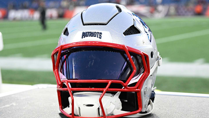 Nov 17, 2024; Foxborough, Massachusetts, USA; A New England Patriots helmet sit on an equipment case after a game against the Los Angeles Rams at Gillette Stadium. Mandatory Credit: Eric Canha-Imagn Images