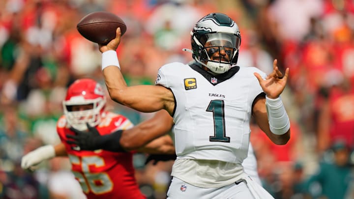 Sep 14, 2025; Kansas City, Missouri, USA; Philadelphia Eagles quarterback Jalen Hurts (1) passes the ball against the Kansas City Chiefs during the first quarter of the game at GEHA Field at Arrowhead Stadium. 
