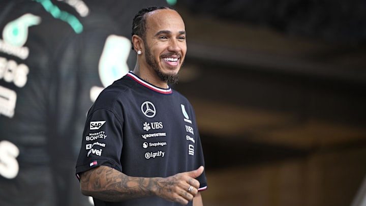 Oct 19, 2024; Austin, Texas, USA; Mercedes AMG Petronas F1 Team driver Lewis Hamilton (44) of Team Great Britain smiles to the crowd during a fan forum before the Sprint Race in the 2024 Formula One US Grand Prix at Circuit of the Americas. Mandatory Credit: Jerome Miron-Imagn Images