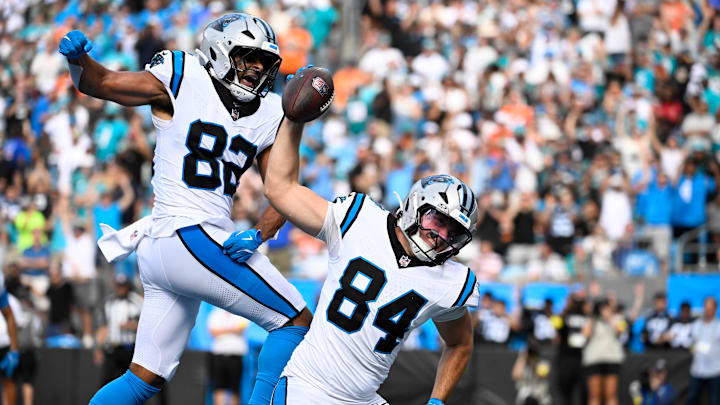 Oct 5, 2025; Charlotte, North Carolina, USA; Carolina Panthers tight end Mitchell Evans (84) spikes the ball after scoring the winning touchdown as tight end Tommy Tremble (82) celebrates in the background in the fourth quarter at Bank of America Stadium. Mandatory Credit: Bob Donnan-Imagn Images Oct 5, 2025; Charlotte, North Carolina, USA; Carolina Panthers tight end Mitchell Evans (84) spikes the ball after scoring the winning touchdown as tight end Tommy Tremble (82) celebrates in the background in the fourth quarter at Bank of America Stadium. Mandatory Credit: Bob Donnan-Imagn Images