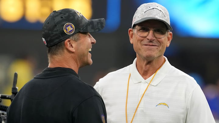 Baltimore Ravens coach John Harbaugh with his brother and Los Angeles Chargers coach Jim Harbaugh