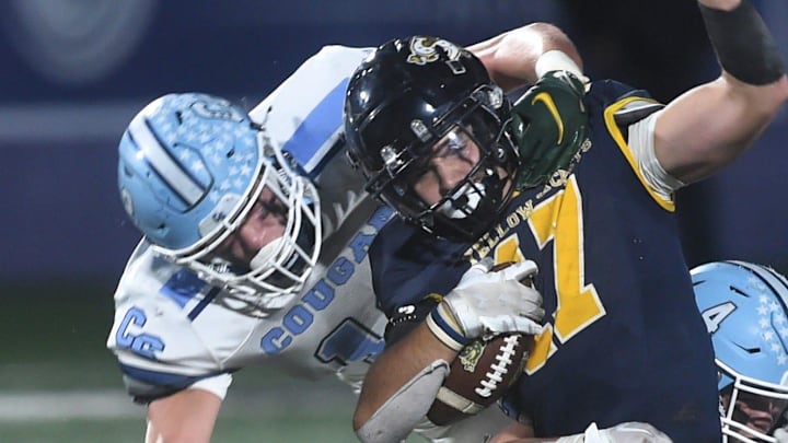 Stephenville's Tate Maruska is tackled by a China Spring defender in the fourth quarter. Stephenville beat the Cougars 31-21 in the District 5-4A Division I game. China Spring will have a new coach in 2026. 