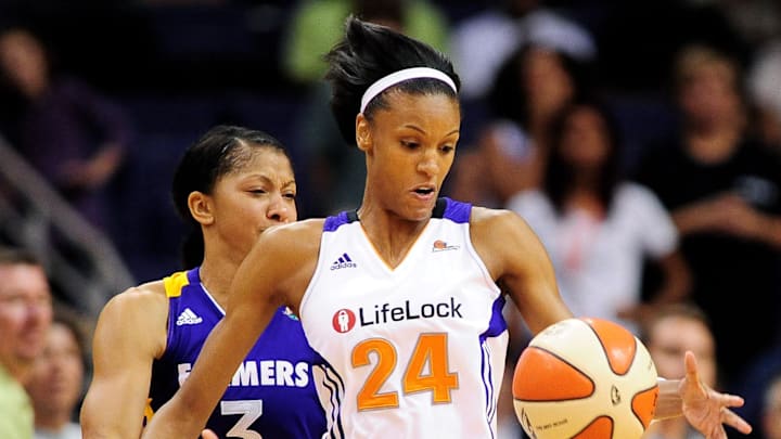 Sep 3, 2011; Phoenix, AZ, USA; Phoenix Mercury guard DeWanna Bonner (24) is guarded by Los Angeles Sparks forward Candace Parker (3) during the second half at the US Airways Center.  The Mercury defeated the Sparks 93-77. Mandatory Credit: Jennifer Stewart-Imagn Images