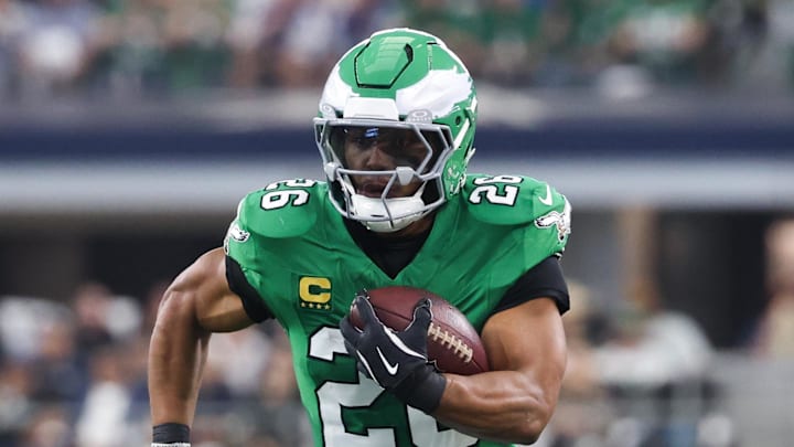 Nov 23, 2025; Arlington, Texas, USA; Philadelphia Eagles running back Saquon Barkley (26) runs with the ball in the first quarter against the Dallas Cowboys at AT&T Stadium. 
