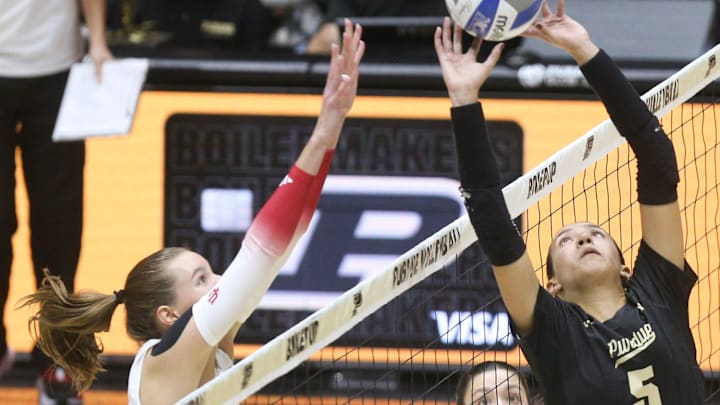 Indiana middle blocker Ava Vickers (11) defends the spike of Purdue setter Taylor Anderson (5) 