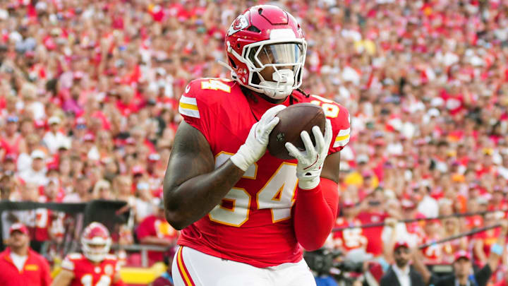 Sep 15, 2024; Kansas City, Missouri, USA; Kansas City Chiefs offensive tackle Wanya Morris (64) catches a touchdown pass during the second half against the Cincinnati Bengals at GEHA Field at Arrowhead Stadium. Mandatory Credit: Jay Biggerstaff-Imagn Images
