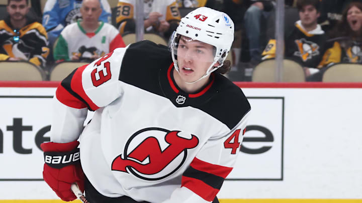 Jan 8, 2026; Pittsburgh, Pennsylvania, USA;  New Jersey Devils defenseman Luke Hughes (43) handles the puck against the Pittsburgh Penguins during the third period at PPG Paints Arena. Mandatory Credit: Charles LeClaire-Imagn Images