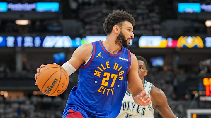 May 16, 2024; Minneapolis, Minnesota, USA; Denver Nuggets guard Jamal Murray (27) dribbles against