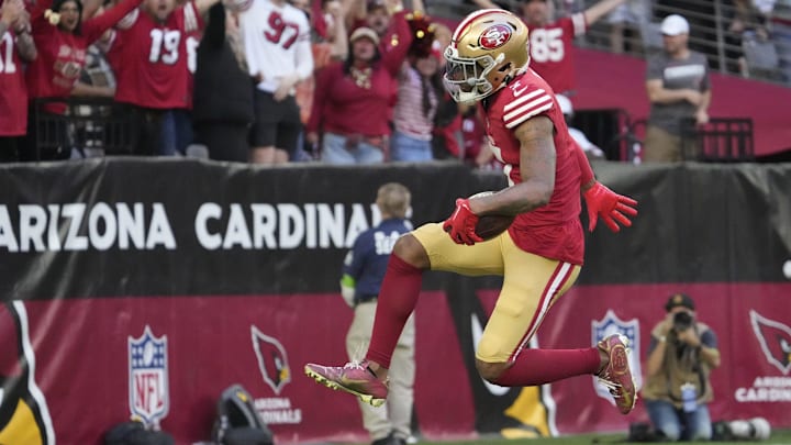 Former San Francisco 49ers cornerback Charvarius Ward (7) returns an interception for a touchdown against the Arizona Cardinals during the first quarter at State Farm Stadium in Glendale on Dec. 17, 2023.
