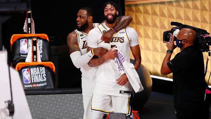 Oct 11, 2020; Lake Buena Vista, Florida, USA; Los Angeles Lakers forward LeBron James (23) and forward Anthony Davis (3) celebrate during the fourth quarter in game six of the 2020 NBA Finals at AdventHealth Arena. The Los Angeles Lakers won 106-93 to win the series. Mandatory Credit: Kim Klement-Imagn ImagesMandatory Credit: Kim Klement-Imagn Images