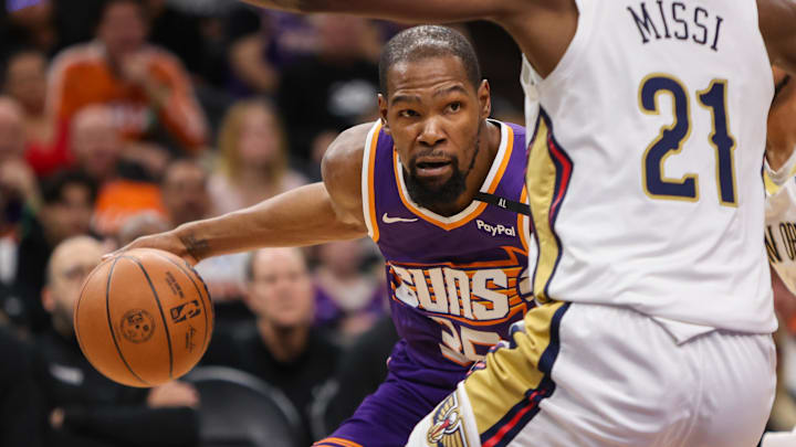 Feb 27, 2025; Phoenix, Arizona, USA; Phoenix Suns forward Kevin Durant (35) is defended by New Orleans Pelicans center Yves Missi (21) in the fourth quarter at Footprint Center. Mandatory Credit: Brett Davis-Imagn Images