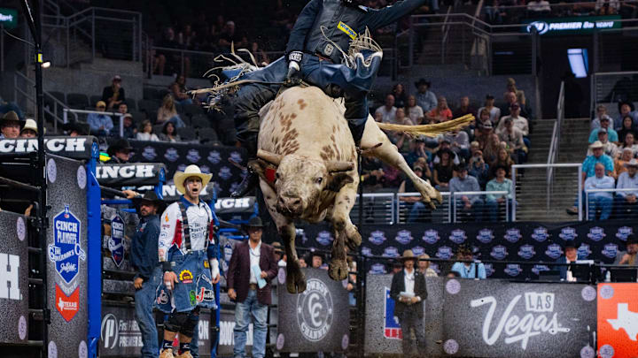 A bull rider A bull rider