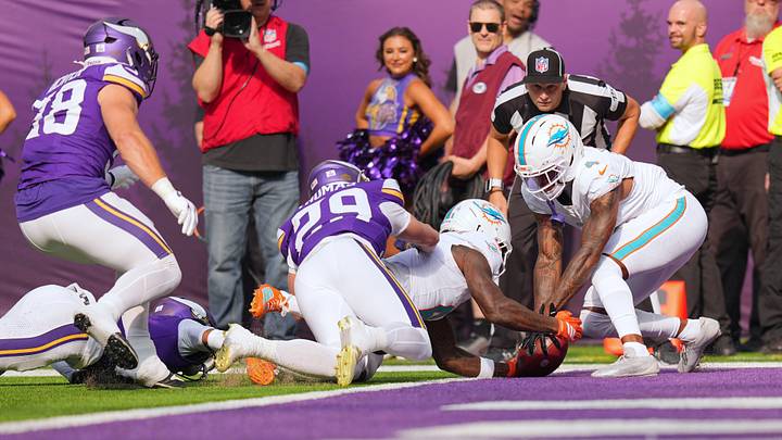 Miami Dolphins wide receiver Malik Washington (6) recovers a kickoff in the endzone for a touchback during the first quarter against the Minnesota Vikings at U.S. Bank Stadium.  