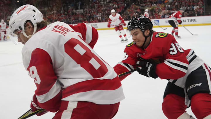 Nov 6, 2024; Chicago, Illinois, USA; Chicago Blackhawks center Connor Bedard (98) checks Detroit Red Wings right wing Patrick Kane (88) during the first period at United Center. Mandatory Credit: David Banks-Imagn Images