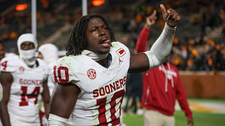 Oklahoma linebacker Kip Lewis celebrates with OU fans at Neyland Stadium.