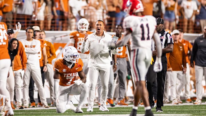 Oct 19, 2024; Austin, Texas, USA; Texas Longhorns head coach Steve Sarkisian and cornerback Jahdae Barron (7) react after a pass interference call in the third quarter against the Georgia Bulldogs at Darrell K Royal-Texas Memorial Stadium.