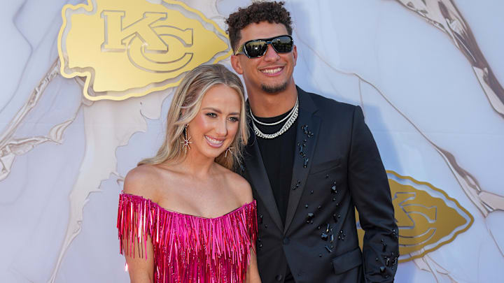Kansas City Chiefs quarterback Patrick Mahomes and wife Brittany pose for a photo on the red carpet at the Nelson Art Gallery.
