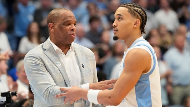 North Carolina Tar Heels head coach Hubert Davis with guard Seth Trimble (7)