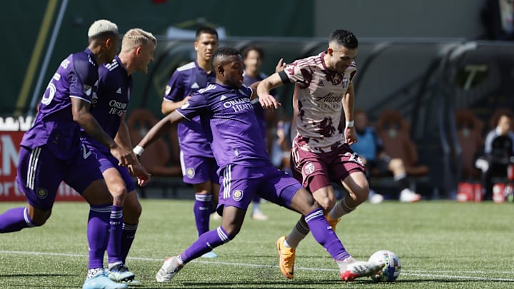 Mar 27, 2022; Portland, Oregon, USA;  Orlando City SC midfielder Andres Perea (21) fouls Portland
