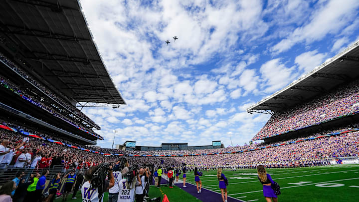 A flyover crosses the stadium after the National Anthem prior to the NCAA football game between the Washington Huskies and the Ohio State Buckeyes at Husky Stadium in Seattle on Sept. 27, 2025. A flyover crosses the stadium after the National Anthem prior to the NCAA football game between the Washington Huskies and the Ohio State Buckeyes at Husky Stadium in Seattle on Sept. 27, 2025.