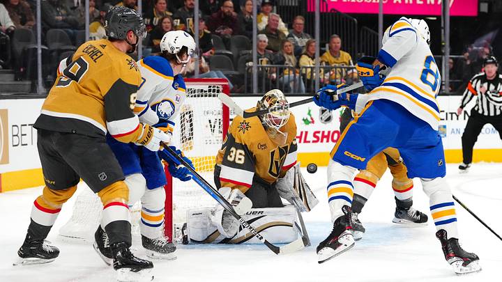 Dec 15, 2023; Las Vegas, Nevada, USA; Vegas Golden Knights goaltender Logan Thompson (36) defends his net against a shot from Buffalo Sabres right wing Alex Tuch (89) during the first period at T-Mobile Arena. Mandatory Credit: Stephen R. Sylvanie-Imagn Images